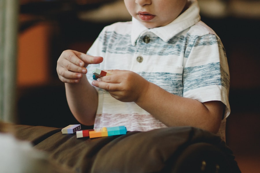 A young child playing with colorful building blocks