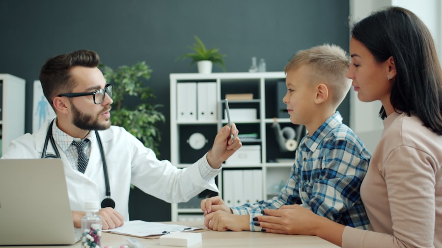 A clinician evaluating a young boy with his parent present