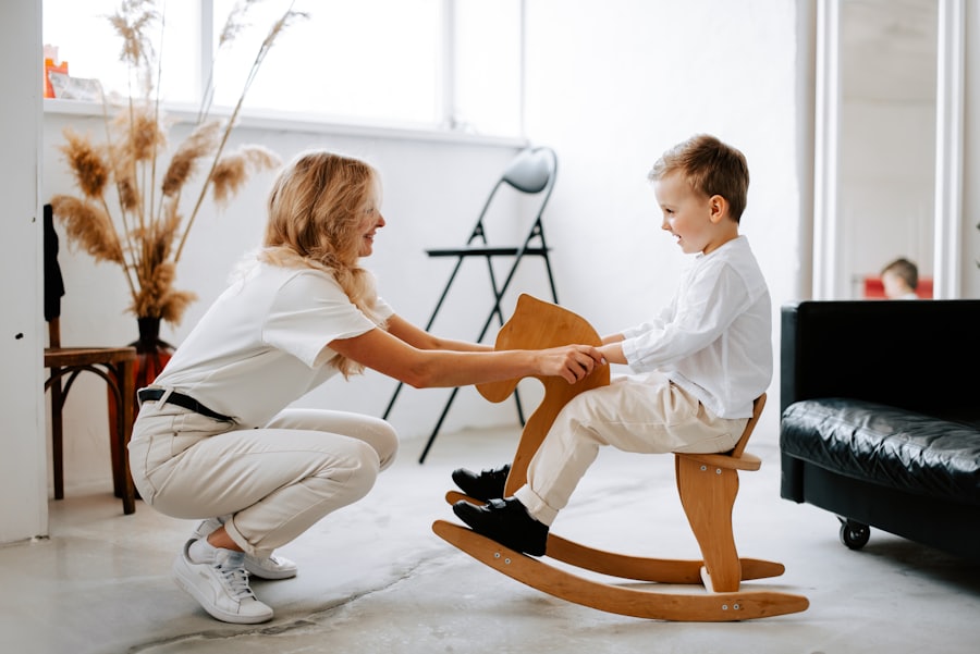 A therapist playing with a smiling child at home